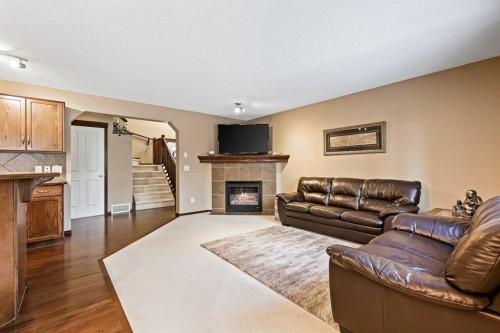 1976 New Brighton Drive Se, Calgary, AB - Indoor Photo Showing Living Room With Fireplace