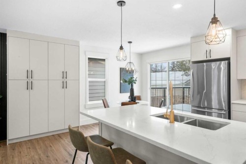 144 Deer Ridge Way Se, Calgary, AB - Indoor Photo Showing Kitchen With Double Sink With Upgraded Kitchen