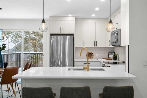 144 Deer Ridge Way Se, Calgary, AB - Indoor Photo Showing Kitchen With Double Sink With Upgraded Kitchen