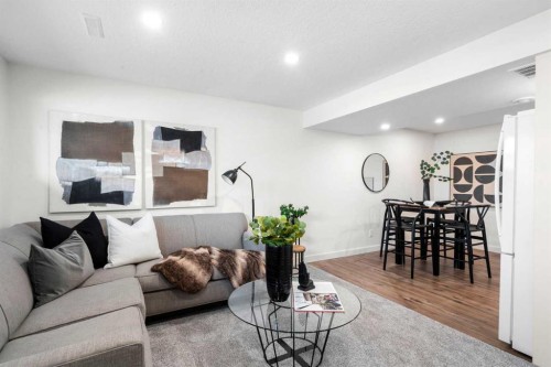 144 Deer Ridge Way Se, Calgary, AB - Indoor Photo Showing Living Room