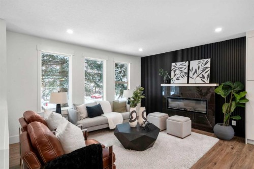 144 Deer Ridge Way Se, Calgary, AB - Indoor Photo Showing Living Room With Fireplace