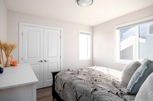 87 Waterford Mews, Chestermere, AB - Indoor Photo Showing Bedroom