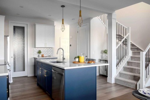 87 Waterford Mews, Chestermere, AB - Indoor Photo Showing Kitchen With Upgraded Kitchen