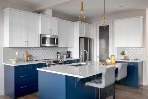 87 Waterford Mews, Chestermere, AB - Indoor Photo Showing Kitchen With Upgraded Kitchen