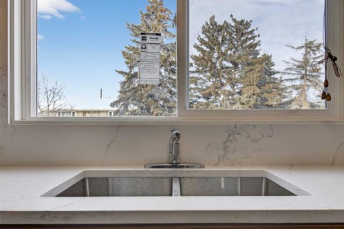 3283 Dover Ridge Drive Se, Calgary, AB - Indoor Photo Showing Kitchen With Double Sink
