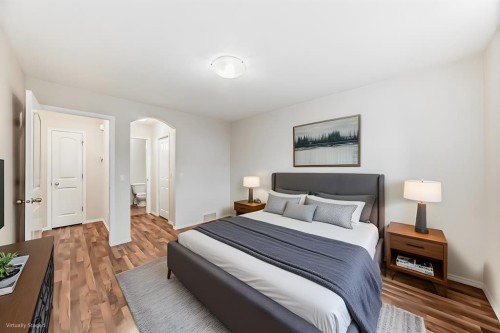 576 Stonegate Way Nw, Airdrie, AB - Indoor Photo Showing Bedroom