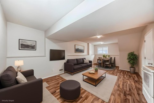 576 Stonegate Way Nw, Airdrie, AB - Indoor Photo Showing Living Room