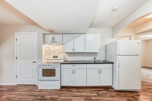 576 Stonegate Way Nw, Airdrie, AB - Indoor Photo Showing Kitchen With Double Sink