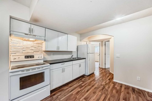 576 Stonegate Way Nw, Airdrie, AB - Indoor Photo Showing Kitchen With Double Sink