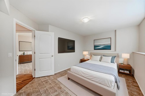 576 Stonegate Way Nw, Airdrie, AB - Indoor Photo Showing Bedroom