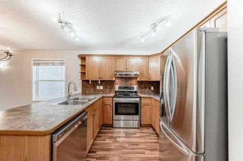 576 Stonegate Way Nw, Airdrie, AB - Indoor Photo Showing Kitchen With Double Sink