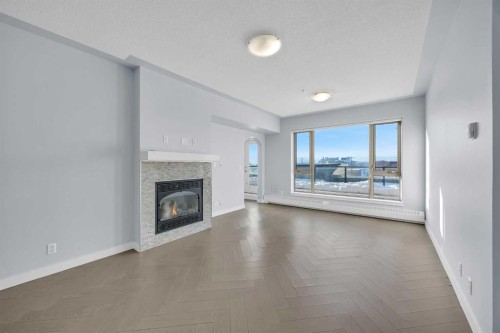 305-35 Inglewood Park Se, Calgary, AB - Indoor Photo Showing Living Room With Fireplace