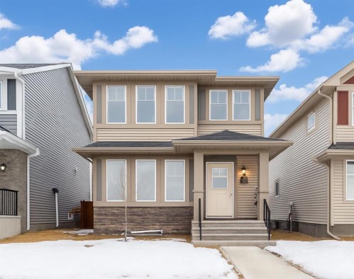 584 River Avenue, Cochrane, AB - Outdoor With Facade