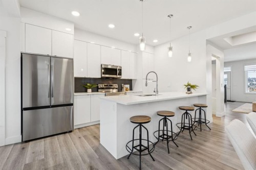 584 River Avenue, Cochrane, AB - Indoor Photo Showing Kitchen With Stainless Steel Kitchen With Upgraded Kitchen