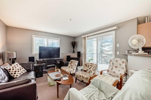 3211-4975 130 Avenue Se, Calgary, AB - Indoor Photo Showing Living Room