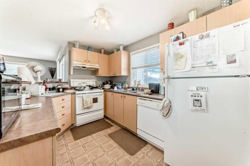 3211-4975 130 Avenue Se, Calgary, AB - Indoor Photo Showing Kitchen With Double Sink