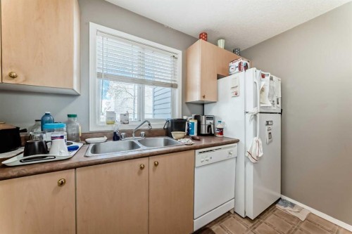 3211-4975 130 Avenue Se, Calgary, AB - Indoor Photo Showing Kitchen With Double Sink