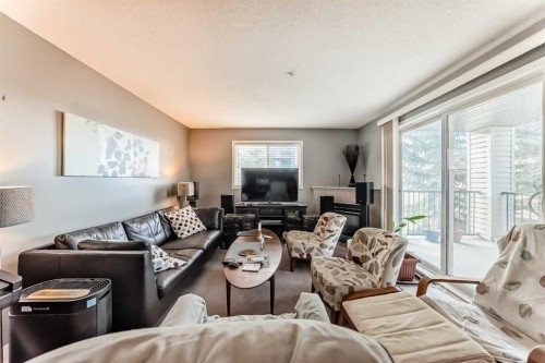 3211-4975 130 Avenue Se, Calgary, AB - Indoor Photo Showing Living Room