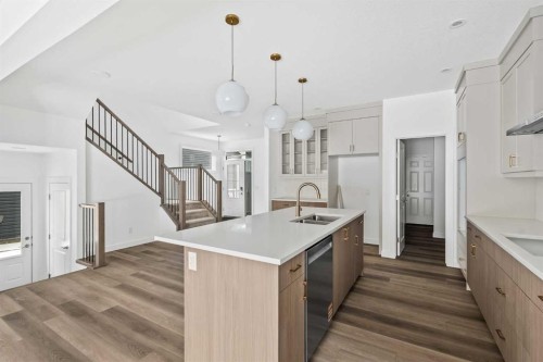 438 Lucas Way Nw, Calgary, AB - Indoor Photo Showing Kitchen With Double Sink With Upgraded Kitchen