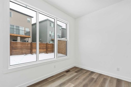 438 Lucas Way Nw, Calgary, AB - Indoor Photo Showing Other Room