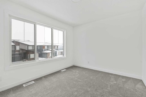 438 Lucas Way Nw, Calgary, AB - Indoor Photo Showing Other Room