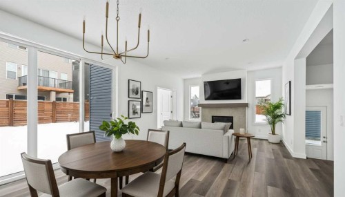 438 Lucas Way Nw, Calgary, AB - Indoor Photo Showing Dining Room With Fireplace