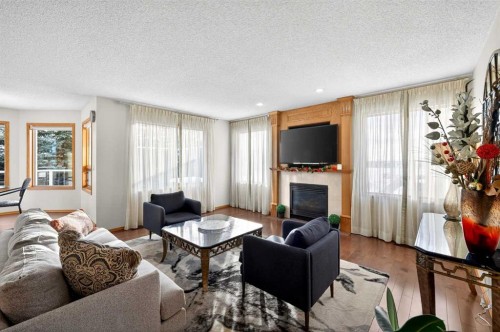 36 Edgevalley Place Nw, Calgary, AB - Indoor Photo Showing Living Room With Fireplace