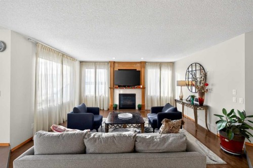 36 Edgevalley Place Nw, Calgary, AB - Indoor Photo Showing Living Room With Fireplace