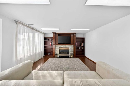 36 Edgevalley Place Nw, Calgary, AB - Indoor Photo Showing Living Room With Fireplace