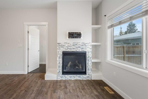 4031 79 Street Nw, Calgary, AB - Indoor Photo Showing Living Room With Fireplace
