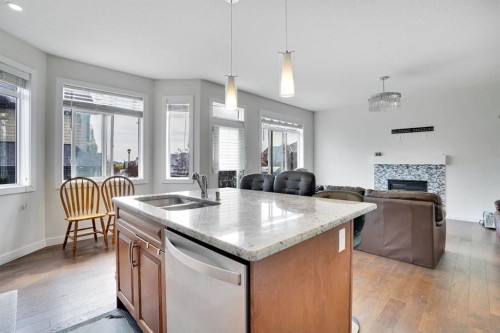 680 Marina Drive, Chestermere, AB - Indoor Photo Showing Kitchen With Fireplace With Double Sink