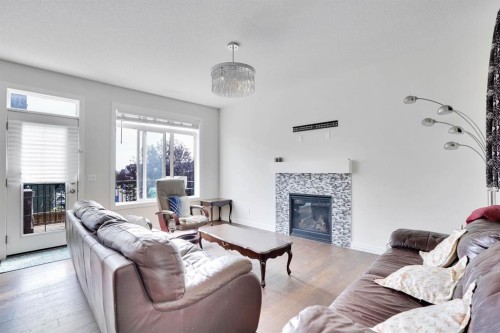 680 Marina Drive, Chestermere, AB - Indoor Photo Showing Living Room With Fireplace
