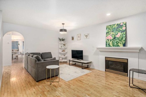 432 56 Avenue Sw, Calgary, AB - Indoor Photo Showing Living Room With Fireplace