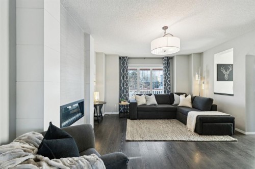 4 Copperfield Rise Se, Calgary, AB - Indoor Photo Showing Living Room With Fireplace
