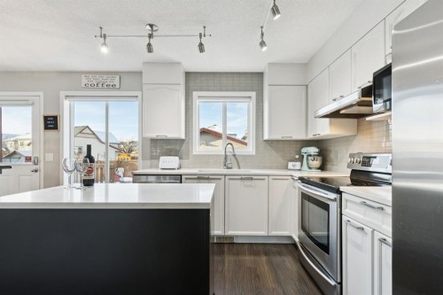 4 Copperfield Rise Se, Calgary, AB - Indoor Photo Showing Kitchen With Stainless Steel Kitchen With Upgraded Kitchen