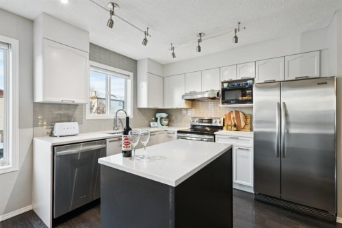 4 Copperfield Rise Se, Calgary, AB - Indoor Photo Showing Kitchen With Stainless Steel Kitchen With Upgraded Kitchen