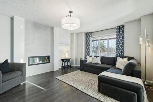 4 Copperfield Rise Se, Calgary, AB - Indoor Photo Showing Living Room With Fireplace