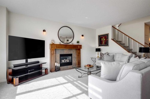 15 Copperfield Close Se, Calgary, AB - Indoor Photo Showing Living Room With Fireplace