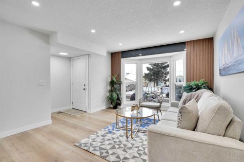 309 Falwood Way Ne, Calgary, AB - Indoor Photo Showing Living Room