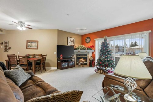104-43 Westlake Circle, Strathmore, AB - Indoor Photo Showing Living Room With Fireplace