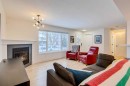 176 Somme Manor Sw, Calgary, AB  - Indoor Photo Showing Living Room With Fireplace 
