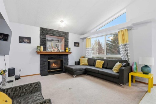 99 Arbour Lake Way Nw, Calgary, AB - Indoor Photo Showing Living Room With Fireplace