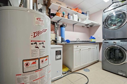 99 Arbour Lake Way Nw, Calgary, AB - Indoor Photo Showing Laundry Room