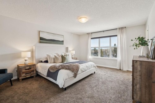 82 Ridge View Place, Cochrane, AB - Indoor Photo Showing Bedroom