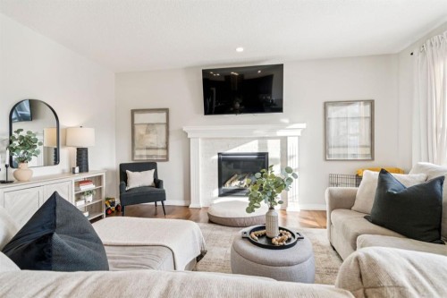 82 Ridge View Place, Cochrane, AB - Indoor Photo Showing Living Room With Fireplace