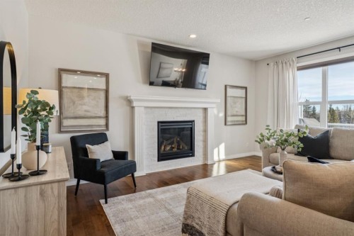 82 Ridge View Place, Cochrane, AB - Indoor Photo Showing Living Room With Fireplace