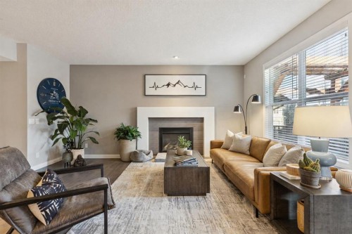 5 Riviera Place, Cochrane, AB - Indoor Photo Showing Living Room With Fireplace