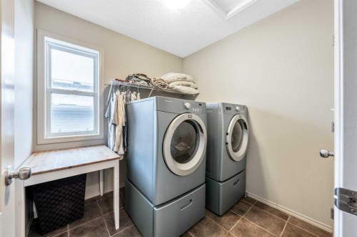 40 Mckinnon Street Nw, Langdon, AB - Indoor Photo Showing Laundry Room