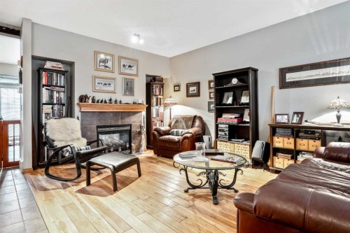 40 Mckinnon Street Nw, Langdon, AB - Indoor Photo Showing Living Room With Fireplace