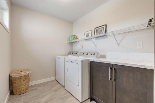 218 Riviera View, Cochrane, AB - Indoor Photo Showing Laundry Room